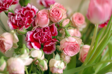 a bouquet of colorful roses and tulips