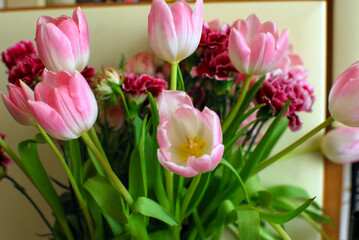 a bouquet of colorful roses and tulips