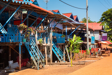 Village street in Cambodia with traditional wooden houses