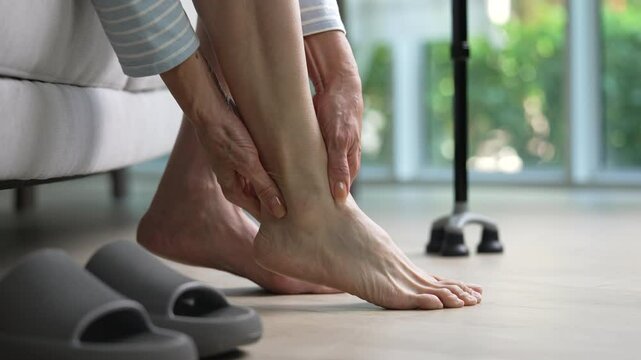 Senior woman suffering from pain in ankle and foot