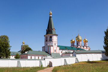 View from the side of Valday lake of the architectural ensemble of the Valday Iversky Svyatoozersky Bogoroditsky monastery on a sunny summer day. Novgorod Region, Russia