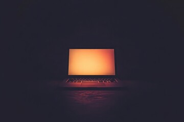 Illuminated laptop screen glowing in a dark room, representing technology and digital connectivity