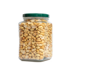 Glass jar with green lid filled with peanuts on isolated white background. Close up of snack peanut filled jar. Nutrition, storage, health and vegetarian concept. Copy space