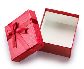 Opened empty red gift box and lid with satin bow near it isolated on white background. File...
