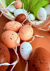 Easter eggs in nest on color wooden background. High quality photo