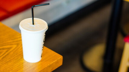 soda cup on wooden table