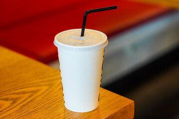 soda cup on wooden table