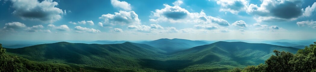 Fototapeta premium Panoramic photo of beautiful green mountains in the Alps, with a blue sky and white clouds. 