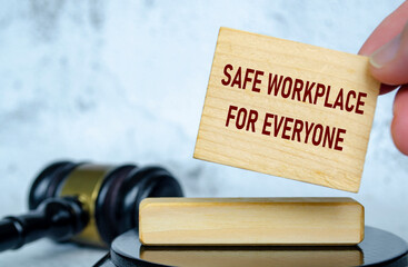 Safe workplace for everyone text written on wooden board with lawyer gavel background