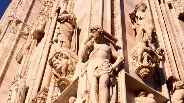 Milan, Italy - March 4th 2025: Exterior of Milan Cathedral Statues, Piazza Del Duomo