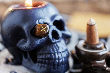 Symbol of runes with a dark skull.