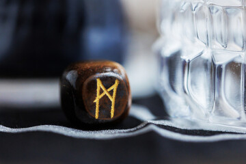 ehwaz rune close up on dark baackground