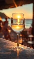 white wine in a chilled wine glass at the bar on the beach