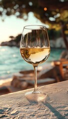 white wine in a chilled wine glass at the bar on the beach