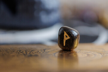 Wunjo rune close up shot. Viking culture concept.