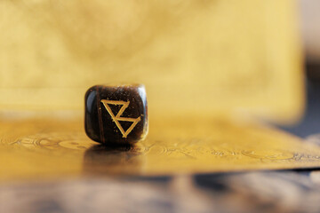Ancient symbol rune. Berkana nordic rune closeup.