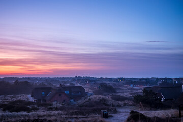 Obraz premium sunrise over cottages in denmark
