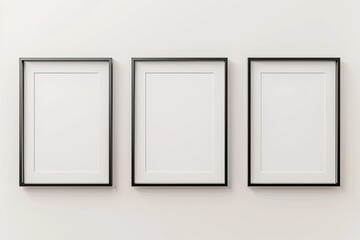 Sharp Picture of Three Blank Frames with Copy Space Hanging on White Wall