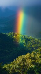 Rain yields to sunlight, casting a radiant rainbow over the lush mountains, illuminating the greenery below. The serene valley transforms into a canvas of colors, creating a peaceful atmosphere