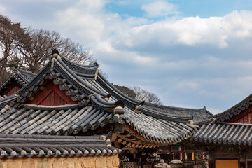 A view of the tiled roof of an old traditional temple (Tongdosa Temple, Korea)