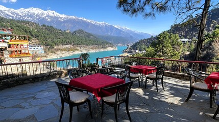 Fototapeta premium Mountain view restaurant terrace, sunny day, colorful village, snow-capped peaks