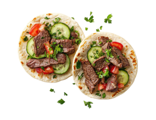 Two beef tacos with fresh toppings, overhead view, scattered herbs