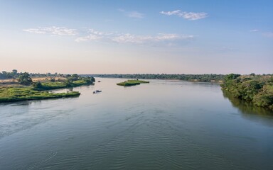 Zambezi River, River expanse, boats, tranquil landscape