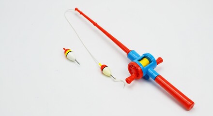 Brightly colored plastic fishing rod gleams under soft studio lighting. AI Generated