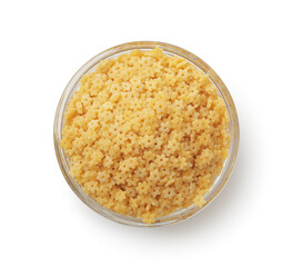 Uncooked stelline pasta in glass bowl