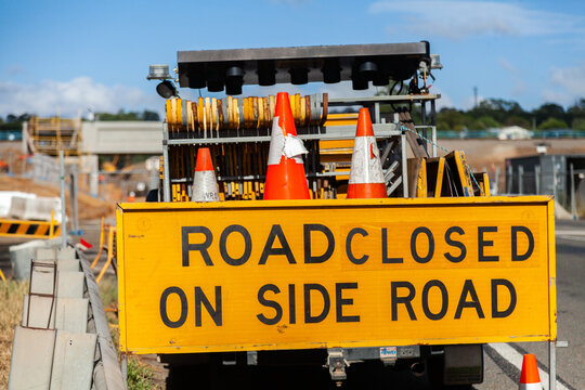 Road closed on side road sign near construction site