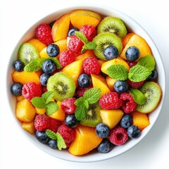 Obraz premium a fruit salad with blueberries, raspberries, kiwi, mango and mint leaves 