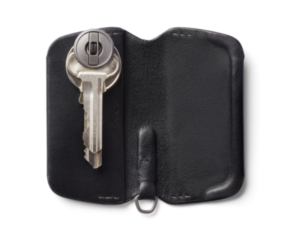 black leather wallet with keys on transparent 