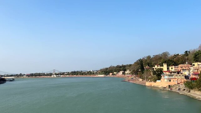 Rishikesh, Uttarakhand, India View of Ganga river embankment, Lakshman Jhula bridge and Tera Manzil Temple, Trimbakeshwar in Rishikesh
