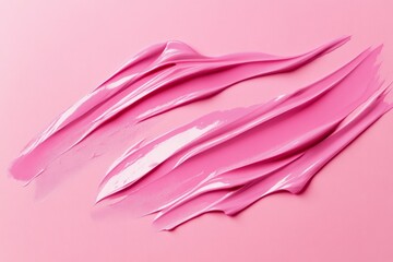 Photo of Fresh lip gloss smears of matt pink color. Detailed photo textured background