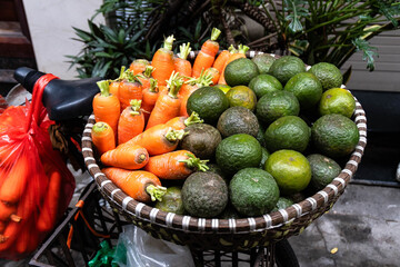 A carefully arranged basket brimming with bright mandarins and limes, representing abundance and joy for the Chinese New Year. Festive decorations enhance the eco-friendly theme beautifully.