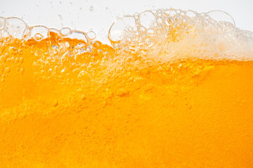 Close up bright orange Oil or beer splash texture and nature waves, Beautiful waves curve and little bubbles smooth for graphic design and background, Oil Bubbles, Soft beer bubbles, Selective focus