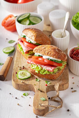 Flavorful sandwich featuring salami, fresh vegetables, and creamy mayonnaise.