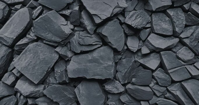 Slow zoom on textured black stone surface in 4K.
Slow-motion close-up of a rough black stone texture with gradual camera movement. 