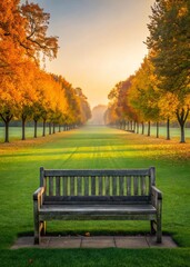 A serene park scene featuring an empty wooden bench surrounded by vibrant autumn trees and a peaceful green lawn at sunrise.