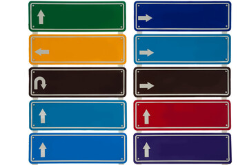 Direction boards displaying various arrows and colors for navigation and guidance purposes