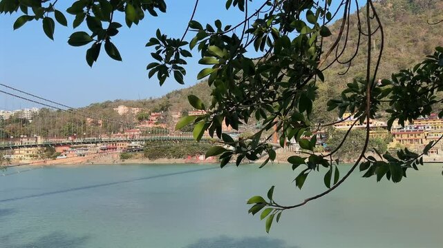 Rishikesh, Uttarakhand, India View of Ganga river embankment, Lakshman Jhula bridge and Tera Manzil Temple, Trimbakeshwar in Rishikesh
