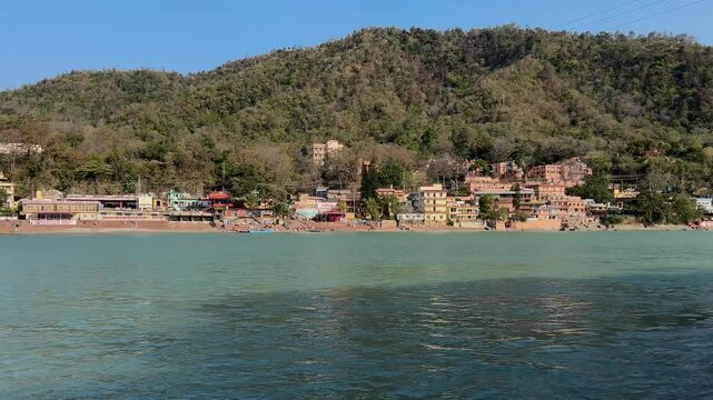 Rishikesh, Uttarakhand, India View of Ganga river embankment, Lakshman Jhula bridge and Tera Manzil Temple, Trimbakeshwar in Rishikesh
