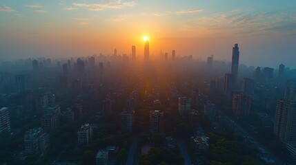Obraz premium Sunrise over a dense city skyline, hazy atmosphere