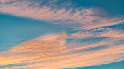 Sunset sky. Cirrocumulus and cirrostratus clouds during sunset. Beautiful dramatic sunset sky background.