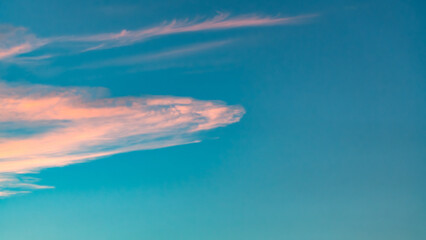 Sunset sky. Cirrocumulus and cirrostratus clouds during sunset. Beautiful dramatic sunset sky background.