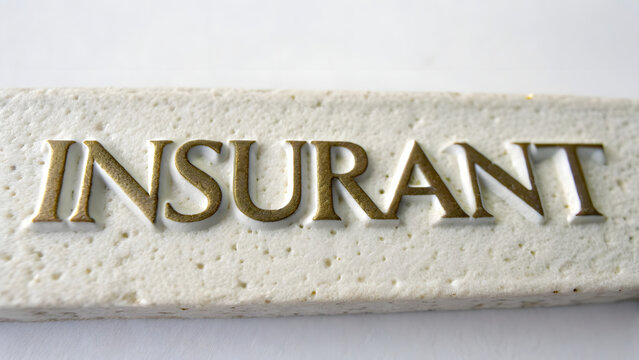 insurant word on wooden background