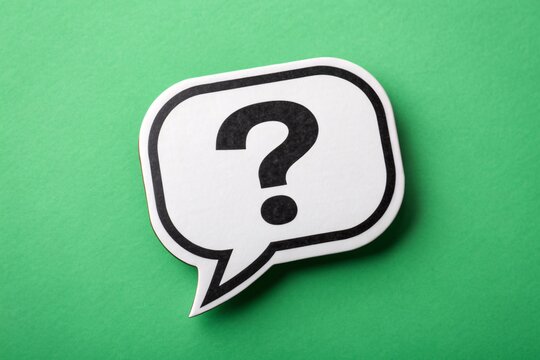 Question mark inside speech bubble on green background, symbolizing curiosity, FAQ, and communication - Powered by Adobe