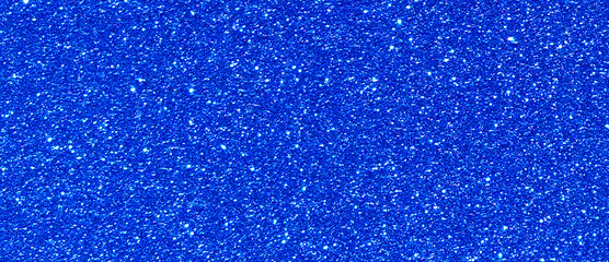 Blue glitter light shining sparkle texture background. Christmas New Year and Celebration...