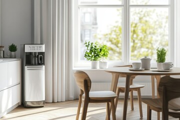 Modern kitchen with water dispenser, dining table, and sunlight.