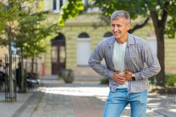 Caucasian man traveler feeling sudden strong abdominal stomach ache, gastritis problem. Upset...